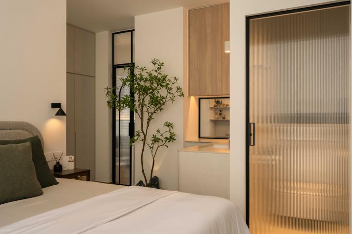 HOFT's The Hillier bedroom with timber cabinetry and fluted glass